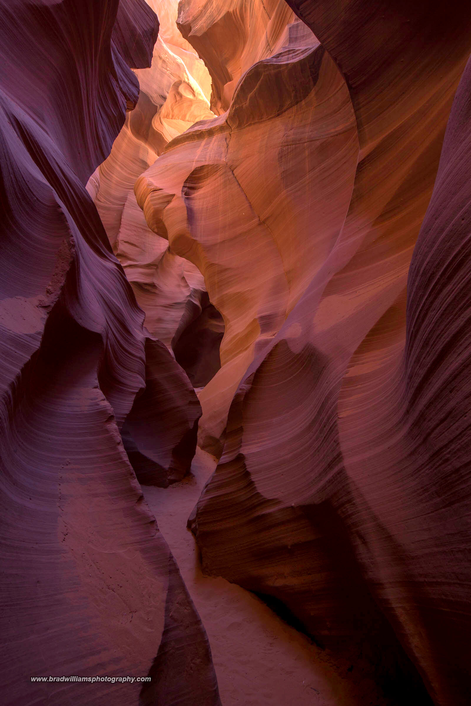 A beautiful scene in Antelope Canyon where all the different ripples in the rock are catching different light.