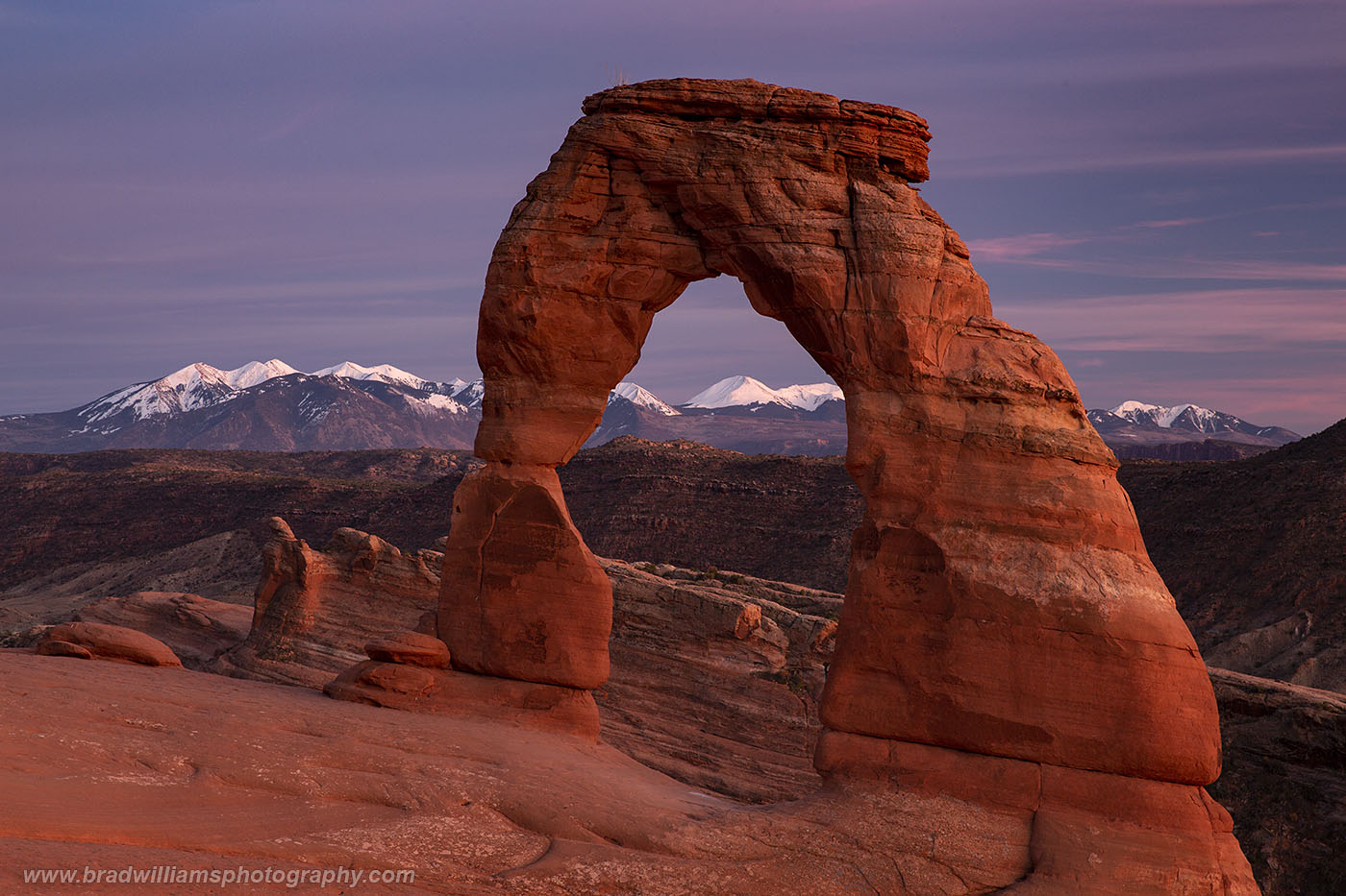 The Icon of Utah, Delicate Arch with the snow capped LaSal Mountains in the background.